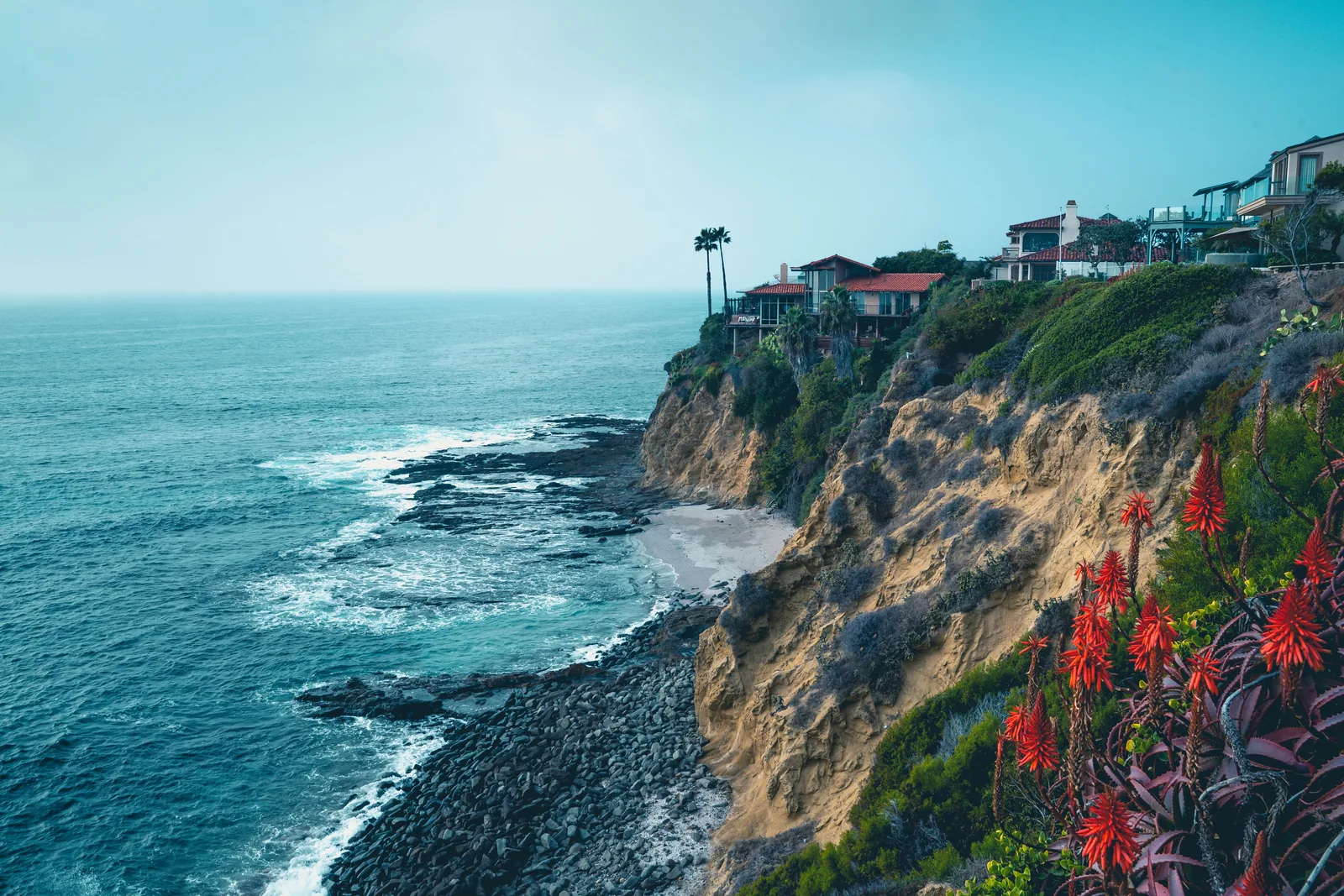 Coastal bluff homes at sunset